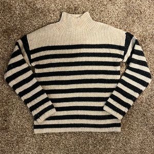 Cream and grey-striped sweater.